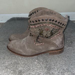 Short suede boots with silver studs and beaded detail